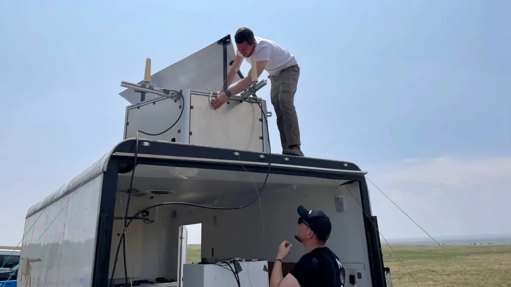 Luis Maestro working on antenna